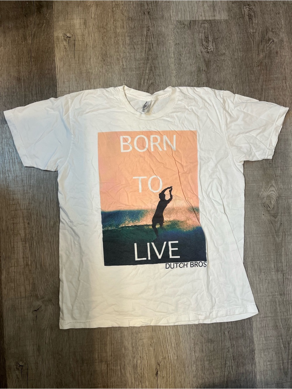 Dutch Bros White Graphic Tee with Sunset Surf Print